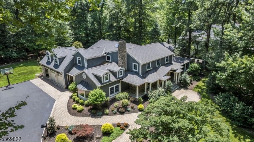 Welcome to 133 Devon Road, a timeless five bedroom Colonial set on just under an acre in the heart of prestigious Essex Fells. Thoughtfully and thoroughly updated in the early 2000's, this residence blends classic charm with modern comfort, offering an ideal setting for both everyday living and unforgettable entertaining.  Inside, you will find a floor plan to inspire connection and relaxation. The heart of the home is the spacious Kitchen, featuring a center island, cozy breakfast area and a fireplace adding warmth and character. Just off the Kitchen is a beautifully appointed dry Bar, perfect for spirited conversation and sharing a favorite beverage with friends. Additional highlights include sunken Living Room with fireplace, a generous Patio with built-in gas grill overlooking a private, tree-lined backyard, an open and welcoming front Porch, and five well-sized Bedrooms including the Primary Bedroom Suite.  Whether hosting elegant parties, casual get-togethers, or simply enjoying day living, this home is a canvas for meaningful moments.  Located in one of northern New Jersey's most sought after communities, this is more than a house- it is a place to live, grow and make memories.