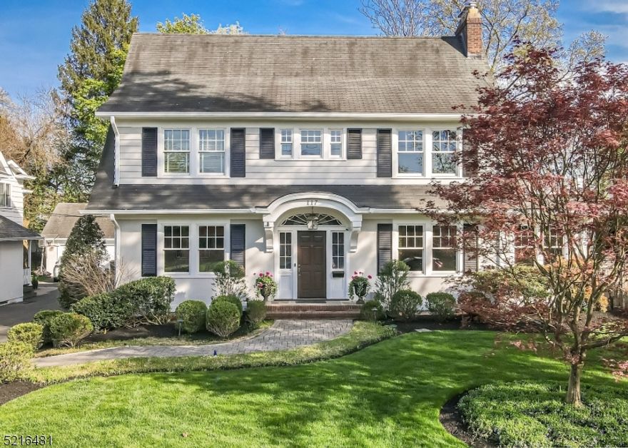 Stunning, completely renovated 5 bdrm center hall colonial blending every modern day amenity with the beautiful vintage charm of the original home. Just a short stroll to charming Downtown Westfield, all schools, Mindowaskin Park and NYC transportation, this location is absolutely outstanding! The gracious entry foyer flows perfectly into a banquet sized dining room with wood burning fireplace. A relaxing family room with custom built ins, wet bar and another wood burning fireplace sits adjacent to the impressive Chef's eat in kitchen with its top of the line appliances, large island & impressive carrara marble countertops. A convenient mudroom with built ins and powder room sits just off the kitchen. A cozy living room and fabulous home office complete this level.  Upstairs, the primary suite boasts a walk-in closet & an elegant bathroom with gorgeous glass stalled shower, inviting soaking tub and double vanity. The 2nd level is also home to three additional bedrooms & two more full baths  including another en suite bedroom. The third level offers another bright, beautiful bdrmm and ample storage. The lower level provides more space to spread out with a lovely kit/laundry room, spacious rec room, exercise room, and another bonus room that can be used as an office/bedroom. The private, fenced in backyard is beautifully landscaped and offers the perfect setting for entertaining outdoors on its gorgeous bluestone patio with wood burning fireplace...