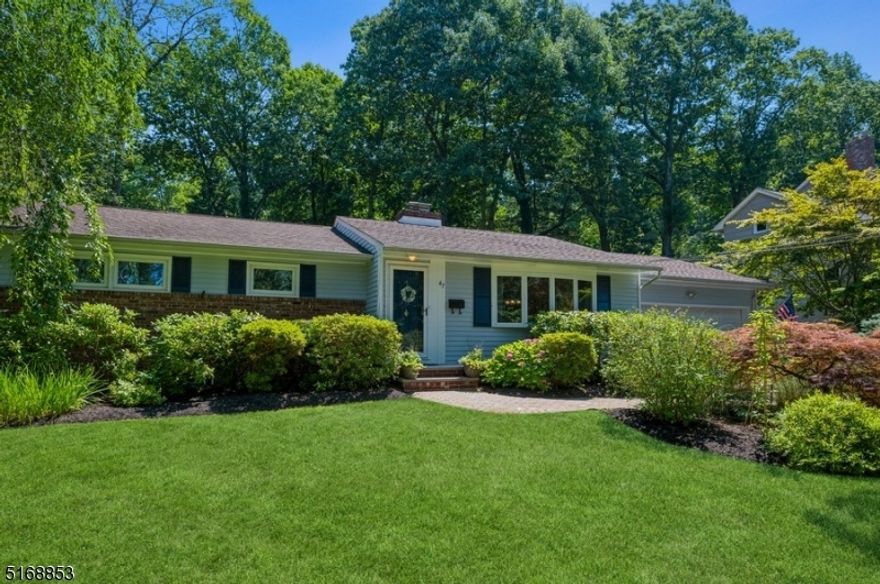 Impeccably renovated, superbly located!  Meticulously updated Ranch home with 3 bedrooms and 2 full bathrooms is packed with features and finishes you can see and feel. Set on a manicured lot on a tree-lined street, this home is near schools, stores, and restaurants with easy access to major highways and parks.  An extra-wide driveway to the attached two-car garage leads to a stone paver walkway and entry to the foyer. The open design interior features hardwood floors, lots of natural light, and a cool, neutral color palette. The sun-washed living room with a large bow window and a sleek wood burning fireplace flows to the formal dining room. The updated kitchen is bright and airy with granite counters, stainless steel appliances, beautiful cabinetry, and a cozy breakfast nook next to sliding glass doors. Outside, the large deck is perfect for warm weather entertaining as you look out on the lush back yard with mature shade trees.  The bedroom wing includes the large primary bedroom, two additional bedrooms, and a full hallway bathroom. The finished basement offers even more living space with a huge family room, a large recreation or office area, a full bathroom, laundry room, and plenty of storage.  All this plus, a Timberline GAF roof, and an in-ground Hydrotech sprinkler system, new driveway.  Ready to move in!