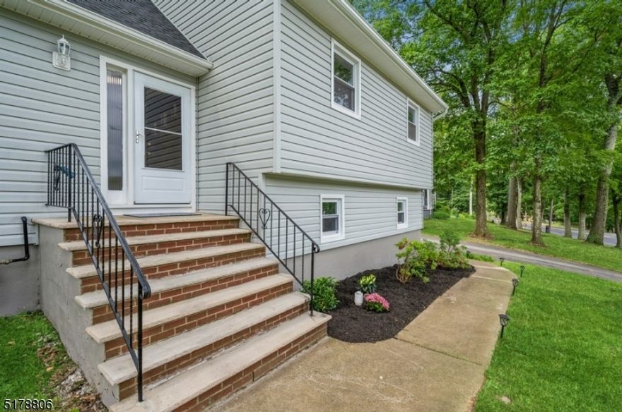 This move-in ready completely renovated split level has everything you need including lake rights! An exclusive driveway with ample parking leads you to this house in the desirable Shongum Lake Community. The home has 4BR, 2FB, 2HB, and an oversized 1-car garage and is only .5 miles away from the beach & clubhouse. This home is sizable with 4levels of livable space + an unfinished basement that can be used for storage or finished! The basement has utilities and washer/dryer hookups and slop sink. Enter thru the garage to the ground floor which has a large family room with a wood-burning insert, 1HB and a sliding glass door to the outdoor patio. Next level up, 1st floor is the main entrance with a formal foyer, and hall closet and opens to LR which has beautiful windows letting in natural sunlight. On this same level you find a brand-new kitchen W/ stainless-steel appliances, granite countertops, and custom cabinetry. Off the kitchen is the dining area, which can be used as a casual eat-in or for more formal dining. Off the dining area is a sun-filled 3seasons room with a sliding glass door that opens to a back deck overlooking a private backyard. On the 2nd floor, you find the primary bedroom with en suite + two additional bedrooms as well as the main FB in the hallway. next up to the 3rd floor which has a nice-sized bedroom with a HB, closet and access to attic storage. Completely move-in ready, the house was converted to public water, public sewer & natural gas