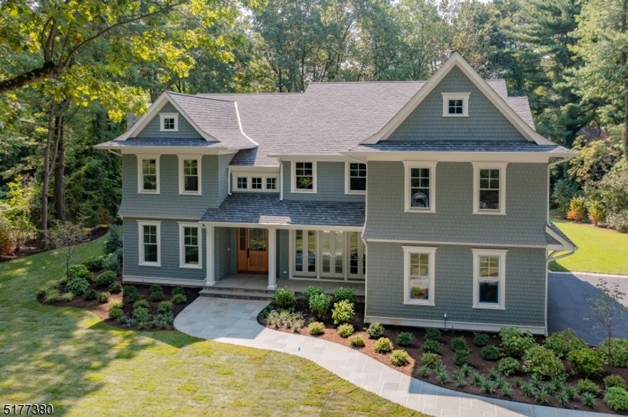 Elegantly sited and situated on Chatham's premier street, 70 Linden Lane is a unique combination of grace and sophistication. Extensive attention to detail and incredible high-end features bring this newly crafted home into the forefront of luxury living. Created and constructed  by Triano Building Company, this 7 bedroom, 7 and 1 half bathroom home boasts over 8350 square feet of gracious living space. Special features of this unique home include; wide bluestone front walkway, solid mahogany 10' door, thoughtfully designed custom pantry furnished with a beverage refrige. and shelving, an extraordinary owner's suite w/ gas fireplace, expansive walk-in closets and spa bath. The property is further enhanced by a sun-drenched great room, and a sensational outdoor entertaining area of bluestone, a full masonry fireplace, built-in grill, refrigerator and knee wall surround. This dream home is set on nearly   acres with expansive views of the professionally-landscaped grounds and mature trees from almost every room, this home offers tranquility and privacy on perhaps the most beautiful street of custom homes in Chatham. Featuring a full gym,194 bottle temperature controlled wine closet, generously sized bedrooms, finished third floor, and multiple dining and lounging areas indoors and out; opportunities for entertaining and recreation abound! With Chatham's award-winning schools, NJ Transit and NY City just minutes by car, 70 Linden Lane is Chatham's luxury living at its very best!