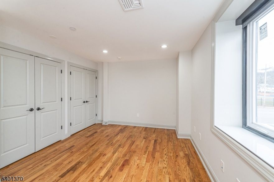 Stunning Brand New 2 Bedroom Apartment " Completely Renovated From Top to Bottom! Be the very first to enjoy this beautifully redesigned 2 bedroom, 1 bath second-floor unit offering modern style, high-quality finishes, and exceptional convenience. This bright and open apartment features brand new hardwood flooring, LED recessed lighting, and generous closet space throughout, creating a clean, contemporary feel in every room. The showstopper is the gorgeous brand new kitchen, thoughtfully designed with soft-close cabinetry, luxurious quartz countertops, and high-end stainless steel appliances, including a high end range, dishwasher, microwave, and refrigerator. Perfect for anyone who appreciates a fresh, modern cooking space. Additional highlights include in-unit laundry, providing maximum convenience, and two dedicated parking spots a rare perk for renters. Every detail has been updated to offer comfort, efficiency, and easy living.Located close to public transportation, shopping, and dining, this unit is ideal for commuters and anyone seeking a stylish, move-in-ready home. Absolutely no pets. A pristine, brand new rental opportunity don't miss it! Public utilities and central air.