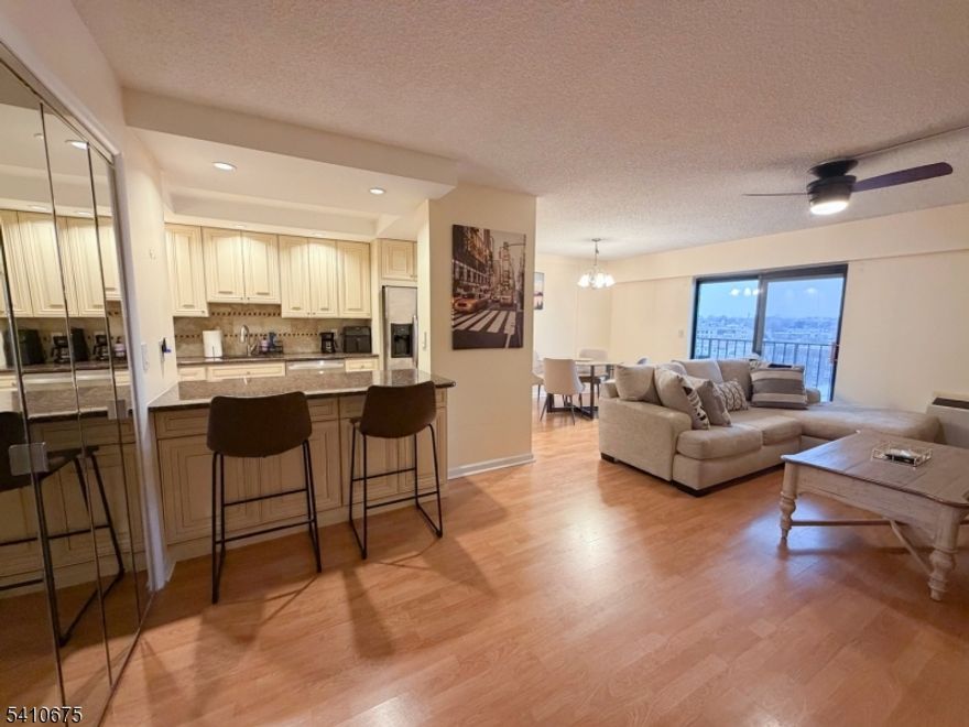 Welcome to Linden Towers, where this top-floor 7th-floor condo offers added privacy, great natural light, and true move-in-ready convenience fully furnished and ready for its next owner. Well maintained and thoughtfully improved, this home is an easy choice for buyers looking for comfort and simplicity. The layout features an open living and dining area that flows into a modern kitchen with newer appliances, including a dishwasher, stove, and microwave. A comfortable bedroom and full bathroom complete the functional floor plan. Clean, finished baseboards throughout give the space a polished and cohesive look. Year-round comfort is provided by newly installed, quiet, efficient, and reliable heating and cooling wall units. A nicely sized private balcony adds valuable outdoor space, and the newly replaced balcony door enhances insulation and overall functionality. Residents enjoy elevator access, laundry facilities on every floor, a secure lobby with daily front desk service, 24-hour security surveillance, and a community parking lot. The HOA includes heat, water, maintenance, snow removal, and trash collection making ownership both convenient and cost-effective.Located next to the Linden train station, commuting to NYC is simple, and nearby shops and restaurants make everyday errands easy. Whether you're a first-time buyer, commuter, downsizer, or investor, this fully furnished condo offers practical, low-maintenance living in a highly convenient location.