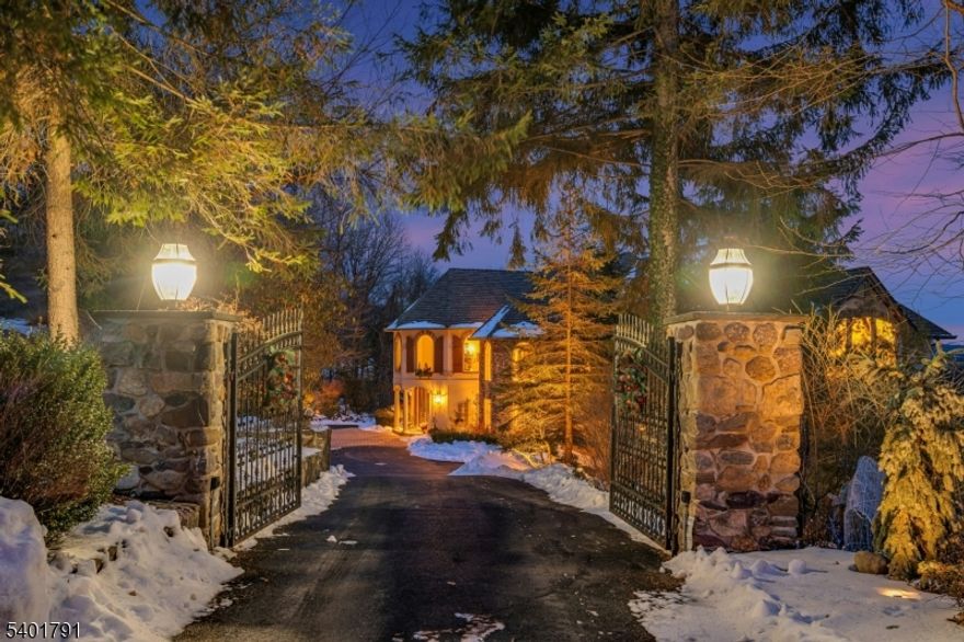 "The Summit," in the heart of the Smoke Rise Gated Community on 3 acres of paradise!   Alluring Entry w/automated iron gates. Grand Foyer welcomes w/ double hand-forged iron bridal staircases!  The 2-Story Octogonal Great Rm with gas f/p and equisite antique mantle opens to custom cherry wetbar joining the Billiard Rm offering gorgeous coffered ceiling and triple door to side yard... GR opens to Kitchen w/cherry cabinetry and built-in Sub Zero, a 48"Viking w/comm hood cooktop,pot fill, 2 Thermador ovens, Miele dishwasher; walk out to 63 X 15ft Veranda w/Panoramic Mountain Views, Castle Bkfst Rm, Impressive 2-Story Formal Din Rm w/hand-cut mosaic boarded stone floors, Butler's Pantry and pass-thru to Kit!  The 3-Car Heated Garage opens to Kitchen and completes the main level; all w/radiant heat!  Retreat upstairs to two left wing BRs to share a Bath and staircase to 3rd Level Lounge w/storage PLUS, BR#4 w/Private Bath,Sitting, Laundry Rm, Romanic Grand Suite w/Dressing Rm 3 WICs + vanity, Lux Bath w/soaring ceilings, walkin shower w/jets/rain shower, heated towel bar complete the upper level. The lower level offers BR #5, Bath, Sauna, Fam Rm, Kitchenette, Movie Theater, Gym, plus storage and walks out to covered 50 X15 Patio with Rain Wall and Fire Wall, I/G Heated Pool, Pool House, and Builtin Dinette, Lavish Firepit Area, Swim Spa/Hot Tub, Pickleball Court, Huge Slide, fountains, veggie garden & rose garden...Whole Home Auto Generator, Sprinklers and Illumination Lighting...