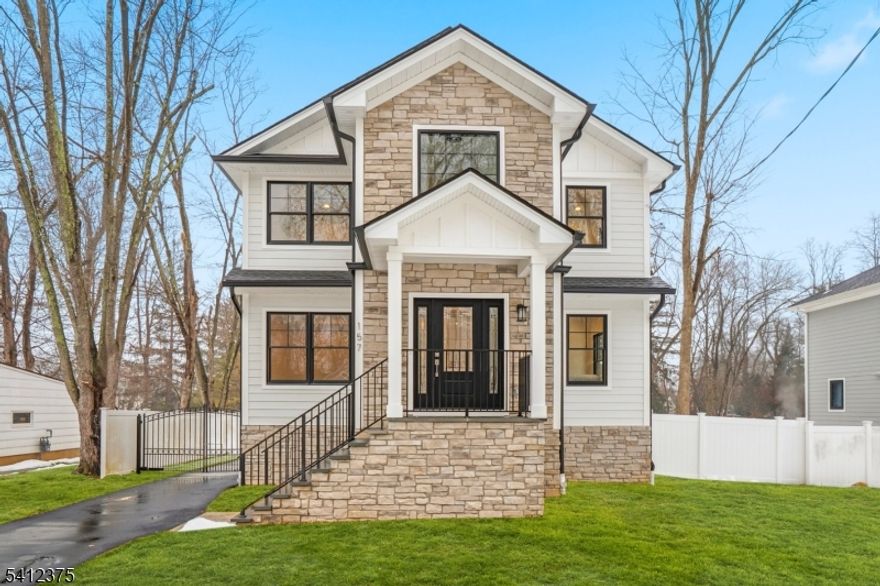 Stunning newly renovated Colonial in a quiet residential setting offering 5 bedrooms and 5 full baths across beautifully designed living space. Featuring 9' ceilings on the first and second floors, solid hardwood flooring, custom LED lighting, and refined finishes throughout. The gourmet kitchen is equipped with semi-custom cabinetry, a large center island, quartz countertops, and premium Thermador appliances, including refrigerator, range, dishwasher, microwave, and hood. The inviting family room with electric fireplace creates a warm focal point for everyday living and entertaining. Upstairs includes a second-floor sitting area and convenient laundry room. The private primary wing offers a spacious suite, custom walk-in closet, and spa-inspired bath with double sinks, soaking tub, and oversized shower. The fully finished basement provides additional recreation space. Exterior highlights include Hardie siding with board-and-batten accents, Andersen casement windows, covered front porch, composite front and rear decks, premium asphalt roof, fiberglass entry door, paved driveway and walkway, and automatic steel dual-swing driveway gate. Set on a 10,000+ sq ft lot with a custom landscaped rain garden. Additional features include a two-zone high-efficiency HVAC system, high-efficiency water heater, 200-amp electrical service, French drain, and sump pump.