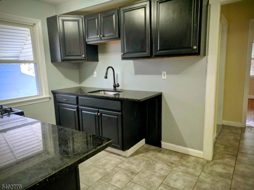 Welcome to your new home in the heart of Irvington! This charming three-bedroom, one-bathroom bi-level apartment offers the perfect blend of classic character and modern convenience. Step inside to discover beautiful hardwood floors that flow throughout the space, adding warmth and elegance to every room.This thoughtfully renovated apartment provides comfortable living across multiple levels, giving you distinct spaces for relaxation and entertainment. The primary bedroom offers a peaceful retreat, while the two additional bedrooms provide flexibility. .Located in Irvington's vibrant neighborhood, you'll enjoy easy access to everything you need. Public transportation options, including the nearby Irvington Bus Terminal, make commuting a breeze whether you're heading to work or exploring the greater Newark area. The Maplewood train station extends your travel options even further.Daily errands become simple with convenient grocery shopping at Extra Supermarket and other local retailers within reach. You will appreciate the proximity to Irvington High School and the peaceful green space at Saint Peters Park, perfect for weekend picnics or morning jogs.Don't miss this opportunity to Call this beautifully updated apartment home. With its combination of classic features, modern updates, and unbeatable location, this rental won't last long in today's competitive market.