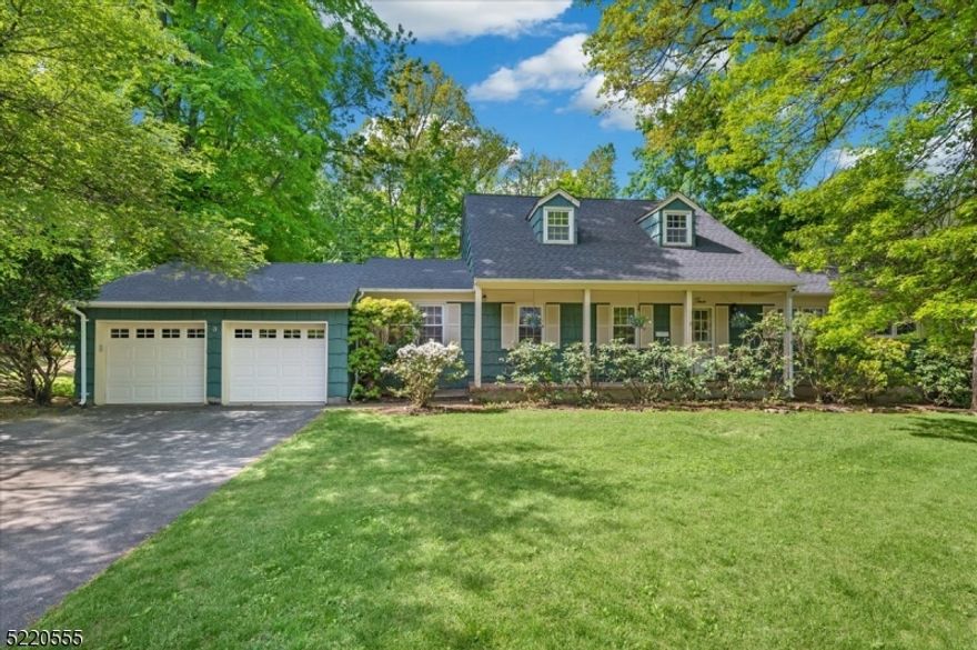Charming Home in an Idyllic SettingSprawling Raised Ranch set on a tranquil, tree-lined .41-acre lot, offering abundant space for comfortable living and grand entertaining. You're welcomed by a lovely covered front porch surrounded by mature landscaping before entering the foyer and open living and dining room beyond featuring gleaming hardwood floors, New Roof, and recessed lighting. A large eat-in kitchen with plenty of cabinet space and access to a convenient laundry room & attached 2-car garage, as well as a shady patio that's perfect for morning coffee or relaxing reading. A spacious family room has sliding doors out to a wonderful, enclosed porch with lots of space for games or dining al fresco. A serene flat backyard offers lots of room for playing, entertaining, or gardening. On the same main level, down the hall, you'll find the Primary Bedroom with two walk-in closets & a renovated en-suite bath with shower, three generously sized bedrooms with wood floors & lots of closet space, and a full hall bathroom with tub. Two additional bedrooms and bathroom with shower are in the upper level, along with a huge bonus space that's perfect as a playroom or for overnight guests, with access to two storage closets. An unfinished basement houses utilities & plenty of room for more storage. This home is in a prime location just blocks away from shopping, dining, and NJ Transit direct train to NYC, along with Rt. 202, with schools, parks, major highways and more all in proximity.