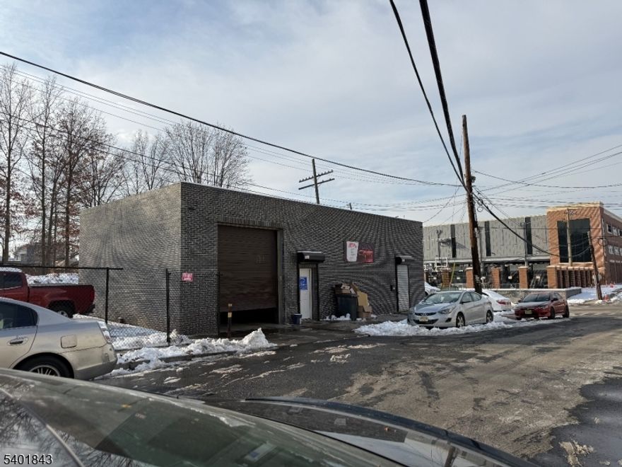 Commercial garage located on a high-visibility corner lot in Elizabeth. Property offers 16-ft ceilings, one overhead door, and an expansive parking lot accommodating 20+ vehicles. Currently operating as an auto repair shop. Convenient to major highways, shopping, public transportation, and Newark Liberty International Airport. Exterior recently updated.