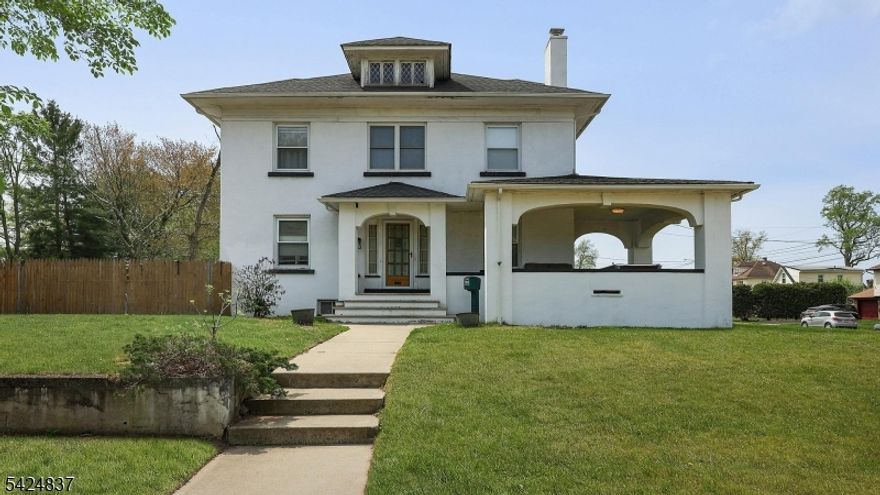 Charming Colonial-style home, distinguished by its classic stucco exterior and generous interior living space. Designed with both comfort and flexibility in mind, this residence offers an inviting layout that adapts to variety of lifestyles. A welcoming open porch sets the tone, offering the perfect spot to relax, unwind, and enjoy the surroundings. The spacious kitchen features a centre island, providing ample room for meal preparation, casual dining, and gathering.  The adjoining living room is warm and welcoming, highlighted by a wood-burning fireplace that creates a cozy focal point for relaxing evenings. Throughout the home, you'll find an abundance of versatile spaces - ideal for a home office, sitting room, or even potential bedroom conversions allowing you to tailor the layout to your needs. A walkup attic adds even more opportunity, whether for storage or future expansion. The basement offers additional flexibility with its own outside entrance, making it well-suited for extended living space, recreation, or future possibilities.