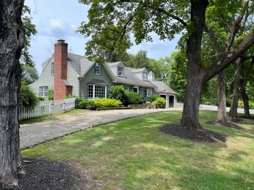 Located on a quiet street in the heart of Oldwick, this beautifully expanded and thoughtfully updated Cape offers the perfect blend of charm, privacy, and village living. Just moments from the beloved Tewksbury Inn, Oldwick General Store, local parks, playgrounds, and charming amenities.This Cape features 3 bedrooms, 2 full baths, 2 car garage, central air, and a beautifully restored in-ground gunite pool. The home showcases refined design and elegant, high-end finishes. The kitchen is a true standout, featuring custom wood cabinetry, sleek black countertops, a center island with sink and stovetop, a Sub-Zero refrigerator, and two built-in ovens.The dining room is enhanced with classic wainscoting, while the living room is accented by rich green grasscloth wallcovering. A second living space is anchored by a stunning stone fireplace creating a warm and inviting focal point. Upstairs, a newly renovated full bath adds modern comfort and style. Additional features to note: a new roof, new furnace, Roth oil tanks, public sewer, UV light for well water, and a dry basement w/an additional room and cedar closet. A heated studio provides flexible space ideal for a office/creative retreat. The large yard, offers privacy with a bluestone patio, mature emerald-green trees and updated white picket and rear fencing.This is a rare opportunity to own a stylish, move-in ready home in one of Oldwick's most desirable neighborhoods, where peaceful surroundings meet vibrant village charm.