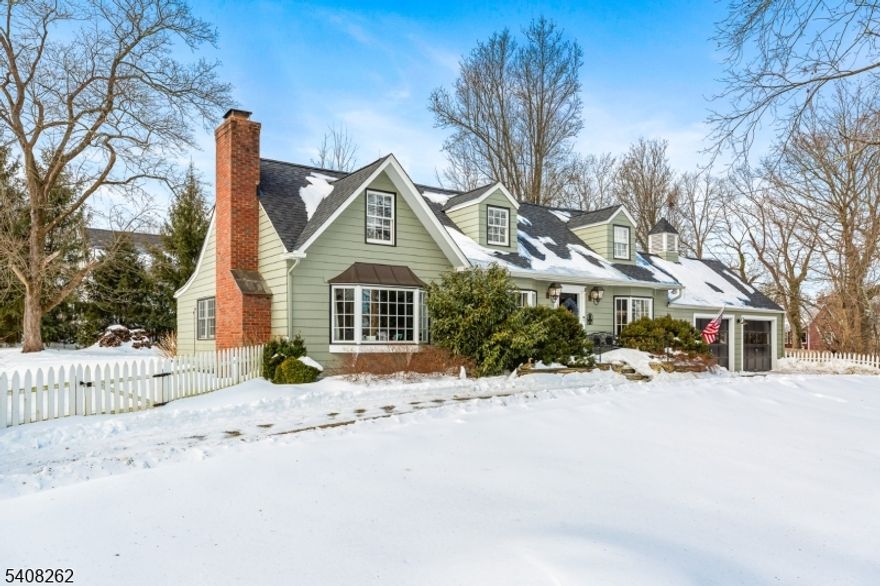 Located on a quiet street in the heart of Oldwick, this beautifully expanded and thoughtfully updated Cape offers the perfect blend of charm, privacy, and village living. Just moments from the beloved Tewksbury Inn, Oldwick General Store, local parks, playgrounds, and charming amenities.This Cape features 3 bedrooms, 2 full baths, 2 car garage, central air, and a beautifully restored in-ground gunite pool. The home showcases refined design and elegant, high-end finishes. The kitchen is a true standout, featuring custom wood cabinetry, sleek black countertops, a center island with sink and stovetop, a Sub-Zero refrigerator, and two built-in ovens.The dining room is enhanced with classic wainscoting, while the living room is accented by rich green grasscloth wallcovering. A second living space is anchored by a stunning stone fireplace creating a warm and inviting focal point. Upstairs, a newly renovated full bath adds modern comfort and style. Additional features to note: a new roof, new furnace, Roth oil tanks, public sewer, UV light for well water, and a dry basement w/an additional room and cedar closet. A heated studio provides flexible space ideal for a office/creative retreat. The large yard, offers privacy with a bluestone patio, mature emerald-green trees and updated white picket and rear fencing.This is a rare opportunity to own a stylish, move-in ready home in one of Oldwick's most desirable neighborhoods, where peaceful surroundings meet vibrant village charm.