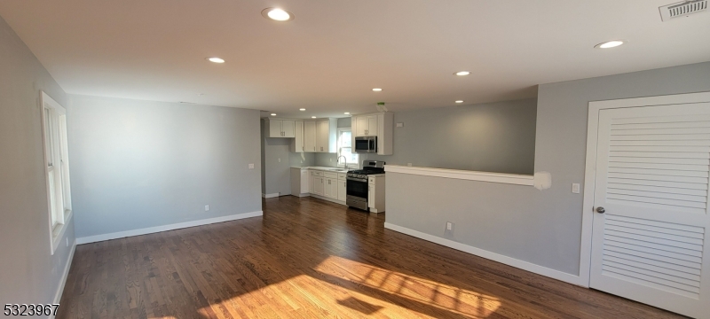 Welcome to this Newly Renovated 2 Family home with Modern Finishes. New Driveway and walkway on right side of house has been installed. First FL. features 2 bd, 1 Ba, with Newly installed vinyl flooring, quartz countertop in the kit, laundry closet, rear deck, and porcelain tiles in the bathroom. Second FL features refinished hardwood FLs, quartz countertop in the kitchen, and porcelain tiles in the bathroom. Both Floors welcomes you with an open Floor concept that come with new Heat and Ac units. The apts also include: New Service, new electrical wiring throughout, new plumbing, new insulation and sheetrock, with recess lighting & access to the backyard. This home is conveniently located near schools, shops, NY bus stop, Passaic Train Station, and 3rd ward Park for all your recreational needs. Property located in a R3 Zone. Has the Potential to convert into a 3 Family with Planning Board Approval. Come visit and hopefully one day call "The Linden St. House" HOME!