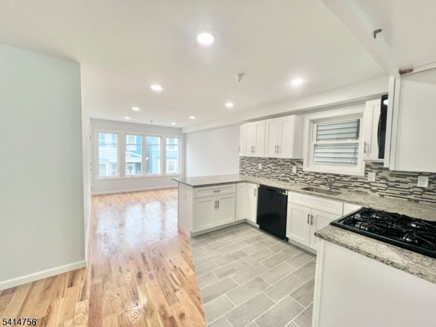 Welcome to this gorgeous 3-bedroom, 2-bath apartment located in the heart of the Ironbound section of Newark. This beautifully designed residence offers a spacious primary bedroom with a private en-suite bath and a walk-in closet, providing both comfort and privacy. The open and airy layout is enhanced by abundant natural light, garage parking, and in-unit laundry hook-ups for added convenience. Ideally situated near major highways, Newark Penn Station, shopping, and schools, this apartment delivers luxury living in an unbeatable location perfect for commuters.