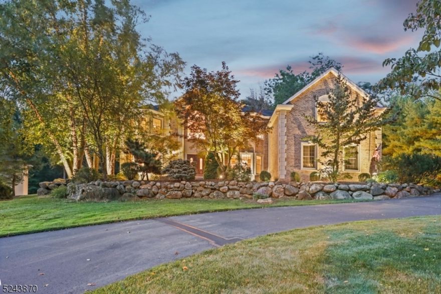 Welcome to a life of luxury! This sprawling, approximately 5,200 square foot six bedroom home sits atop a professionally manicured piece of property in Mahwah's desirable Rio Vista development. Welcoming two-story entry foyer, formal living/piano room, dining room, great room with wet bar & cathedral ceiling, chef's kitchen, private laundry room & first floor bedroom suite. Upstairs boasts the primary suite and another four bedrooms, three of which with ensuite baths. The primary suite is complete with a sitting area, two walk-in closets & full bath with jacuzzi tub & shower. Full, finished basement with bar area, gym, full bath, workshop & ground level exterior access. The spacious backyard has a paver patio with gas/electric and landscape lighting. Amenities include: water filtration/purification, surround sound, whole house vacuum, 3-zone central air, 6-zone heat, 16-zone sprinkler system, alarm system & 3-car garage with charging station. You must see to appreciate the detail!