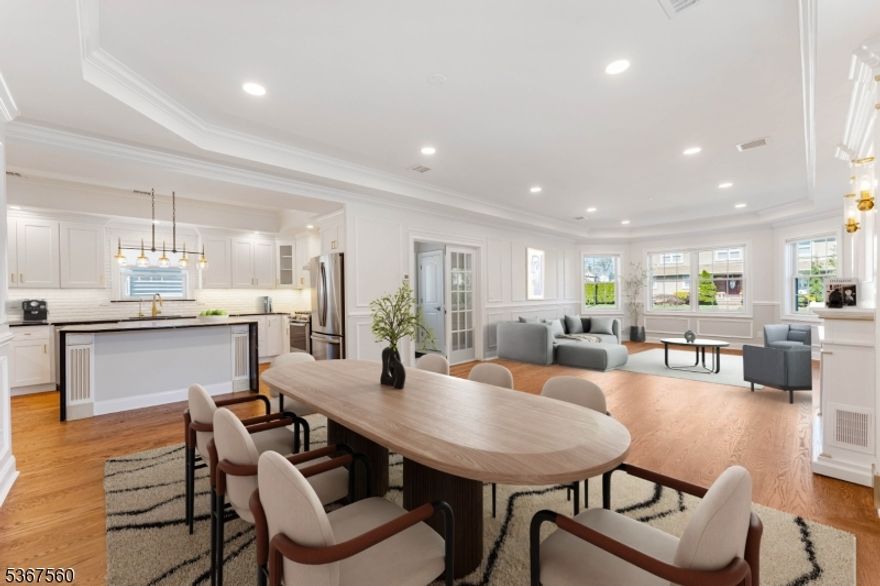 Welcome to this magnificent new construction home, offering modern elegance and thoughtful design on an expansive 40x200 lot. With 5 bedrooms, 4.5 baths, and an array of luxurious features, this home is perfect for those seeking comfort and style. The first floor greets you with an inviting foyer leading to a thoughtfully designed open floor plan. Highlights include a powder room, a spacious living room, and a formal dining room with soaring 9' cathedral ceilings adorned with exquisite crown molding. The state-of-the-art kitchen flows seamlessly into the living spaces, making it ideal for entertaining. This level also features a bedroom with a full bath, perfect for an in-law suite or guest accommodations, as well as a utility room and direct access to the built-in 2-car garage. Upstairs, the second floor boasts 4 additional bedrooms and 3 full baths, including two luxurious master suites with cathedral ceilings. Every detail has been carefully considered, with top-of-the-line materials and finishes throughout. Outside, the property features a long driveway, built-in 2-car garages, and a durable vinyl fence for added privacy. The home is equipped with modern technology, including 6 security cameras with a monitor and DVR system, as well as a front door intercom system with cameras and monitors on both floors for added safety and convenience. With time still available to select your finishes, this home provides a rare opportunity to tailor it to your personal taste.