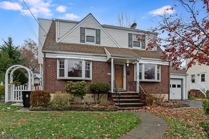 This expanded brick-front Cape offers exceptional space and a prime location tucked away in a quiet neighborhood?yet close to everything. A thoughtful rear addition created an oversized primary suite and a spacious family room featuring a gas fireplace and sliders leading to a large deck overlooking the fully fenced backyard. The main level includes a formal living room, formal dining room, one bedroom, a full bath with tub/shower, and a generously sized eat-in kitchen with stainless steel appliances, granite countertops, and a tiled backsplash. Original hardwood floors run throughout the main level (excluding the addition) and continue through the upstairs bedrooms. The primary suite features a walk-in closet and private entrance to the shared bath. With four bedrooms, two full baths, and an additional second-floor recreation room ideal for a sitting area, office, or gaming space, this home provides versatility for every lifestyle. The partially finished basement adds flexible space for storage or additional living use, along with a laundry area featuring a newer washer and dryer (2021). Completing the home is a one-car garage and key recent updates, including a new roof and solar (2023) and a new air conditioning unit and water heater (2025).