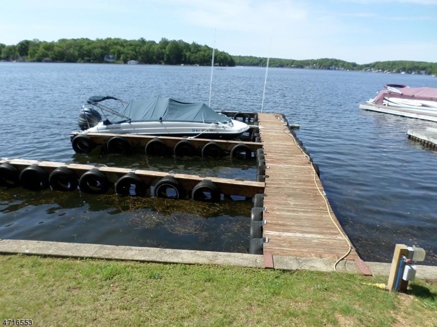 Back up offers only. 2 Marinas separate locations on Lake Hopatcong, 2 residences, plus  commercial bldgs. 75 wet slips 80+ dry dock, 100+ indoor racks, new boat sales, #1 restorer & retailer of antique wood boats, Located on NJ's largest lake only 45 min fr NYC excellent business opportunity w/ 2 locations on the water, one in Lake Hopatcong (Morris Cty) in Great Cove, w/a total of 1.34 acres are 3 buildings totaling 15,500sq ft with a showroom, service bays, and 2 bdrm 1 bath residence and one in Hopatcong (Sussex Cty) in Henderson Cove, on 3+ waterfront acres sit 4 buildings approx. 14,100sq ft consisting of showroom/office, work/wood shops, storage warehouse and a 4 bdrm col with 2 car garage.  Both have hoist systems and ramps. Wood boat location has sterile finish room.  Current 75 wet slips w/room for expansion.