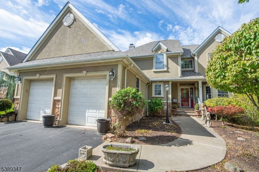 Step inside this elegant Crystal Springs Colonial featuring an open floor plan & gleaming HW  floors throughout the first level.  Two-story foyer leads to LR and formal DR, both with bay windows. Nicely-equipped kitchen has updated countertops, ceramic tile floor, stainless steel appliances, & ample cabinets. Breakfast nook & EIK flow seamlessly into the family room with a gas FP, perfect for relaxing. Oversize deck w/retractable awning has spectacular mountain views - an ideal spot for morning coffee or evening barbeque. The second floor offers 3 bedrooms, including an impressive primary suite featuring a cozy fireplace and two walk-in closets.  Spa-inspired en-suite includes a marble double-sink vanity, stylish walk-in shower, and a slipper tub!  Truly a private sanctuary to unwind and recharge! Two more bedrooms and a full bathroom with tub/shower complete this level. Walk-out basement offers tons of storage, plus a partially-finished room with sliders to patio & windows with a lovely view - great spot for an exercise room!  Rough plumbing for bathroom in basement. Thoughtful enhancements include a heated en-suite floor, mudroom expansion for laundry & pantry, & an enlarged DR window offering amazing views. The beautifully landscaped 0.31 acre lot and stunning mountain views create a setting you'll love coming home to!  Countless local recreational activities; 6 premier golf courses at Crystal Springs Resort! Some photos are digitally enhanced to remove decorative items.