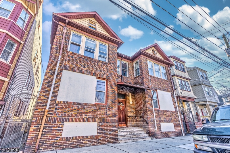 Welcome to 277-279 N 5th Street, a spacious 4-unit property located in North Newark. This multi-family's interior living space spans more than 4,200 square feet. The partially finished basement runs the width of the entire building and offers the possibility of two additional rental units complimented by two full bathrooms. Two units feature a sunroom, a living room, two bedrooms, a full bathroom, and an eat-in kitchen. The third unit features a sunroom, a living room, three bedrooms, a full bathroom and an eat-in kitchen. The fourth unit features four bedrooms, a living room, full bathroom and eat-in kitchen. The building's 5,001 square foot lot showcases a private driveway that leads to three detached garages in the back of the property. The lot has room for parking 3 additional vehicles in the back. This property is located just one block from the light rail and a few minutes from Newark Penn Station. With endless income opportunities, 277-279 N 5th Street is an investor's dream. Book your tour today!