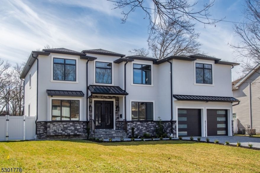 Welcome to this newly constructed colonial nestled in a highly sought-after neighborhood! This stunning residence boasts 5 bedrooms and 5.5 bathrooms. An open concept design highlighted by a large center island in the kitchen, equipped w/ JennAir appliances and a convenient wet bar for entertaining guests.