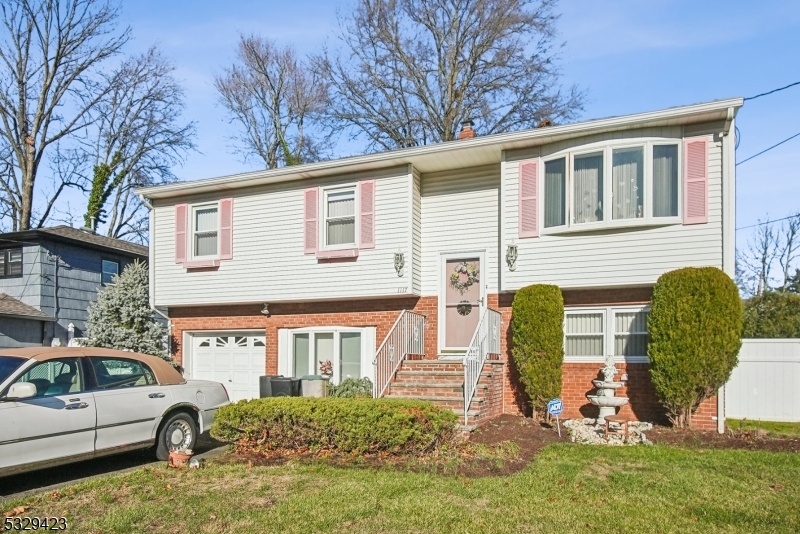 A wonderful opportunity to make this lovely large bi level home your own - spacious home with flexible floorplan allows for you to create your next place - step inside the two story foyer - up the stairs to an elegant large living room with abundant light from the oversized windows - flows into the dining room with plenty of entertaining space for holiday meals - the kitchen has a great layout - down the hall to three bedrooms - the primary bedroom has a private bathroom - the lower level provides a great family room with adjacent bathroom - office space for WFH - and a nicely appointed den with rear yard access - 1 car attached garage - fantastic yard space - all located on a quiet street near Kramer Manor Park with playgound, tennis and walking trails - Scotch Plains has a vibrant downtown with stores, eateries and the train to NYC - Scotch Plains has an excellent school system - this home needs TLC - Welcome Home!