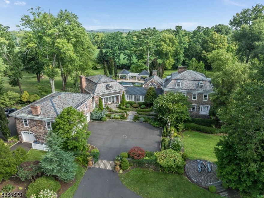 A TRUE GEM & ONE OF HUNTERDON'S MOST HISTORICALLY SIGNIFICANT HOMES, NO EXPENSES WERE SPARED IN RESTORING, UPDATING, AND EXPANDING THIS 11,460 SQ FT, 9BR & 5-1/2 BATH CIRCA-1771 STONE MANOR HOME WHICH WAS ORIGINALLY THE HOME OF REVOLUTIONARY WAR HERO CHARLES STEWART WHO WAS QUARTERMASTER FOR GEORGE WASHINGTON'S TROOPS. LISTED ON BOTH THE NATIONAL AND STATE REGISTRIES OF HISTORIC PLACES, THIS GORGEOUS ONE-OF-A-KIND ESTATE IS SITED ON 47 FARM-ASSESSED ACRES WITH A TOTALLY PRIVATE HOMESITE FURTHER ENHANCED BY TRULY EXTRAORDINARY PERENNIAL GARDENS, TOWERING SPECIMEN TREES, A RECENTLY-RESURFACED HEATED IN-GROUND POOL, A 51x30 OUT BUILDING, & A GREAT LOCATION JUST MINUTES FROM THE PICTURESQUE HISTORIC TOWN OF CLINTON & JUST 1 HR FROM NYC. THE HOME FEATURES A PERFECT-FOR-ENTERTAINING 31x30 GREAT ROOM WITH 20 FT CEILINGS & JERUSALEM MARBLE FLOORS, A 19x18 CATHEDRAL STATE-OF-THE ART CHEF'S KITCHEN AND WAINSCOTED CATHEDRAL CEILING BRKFST RM, AN ENORMOUS LIGHT-BRIGHT-AND AIRY FORMAL LIVING RM, A WOOD-PANELED COFFERED CEILING LIBRARY, A HUGE 21x18 FORMAL DINING RM, AN EXPANSIVE MBR SUITE WITH A LUXURIOUS MARBLE-FLOORED MASTER BATH AND A HUGE CUSTOM OUTFITTED WALK-IN, SPACIOUS ROOM SIZES THRU-OUT, INTRICATELY DETAILED CUSTOM MILLWORK, ORIGINAL HARDWOOD & PUMPKIN PINE FLOORS, A 2BR SEPARATE ENTRY IN-LAW SUITE, AN AUTHENTIC 19TH CENTURY TAVERN RM, 10 FIREPLACES, & SO MUCH MORE. THE SCOPE OF THE HOUSE, ITS TRUE TURN-KEY CONDITION, & SHEER BEAUTY OF THE LANDS MAKE LANSDOWN A GENUINE TREASURE