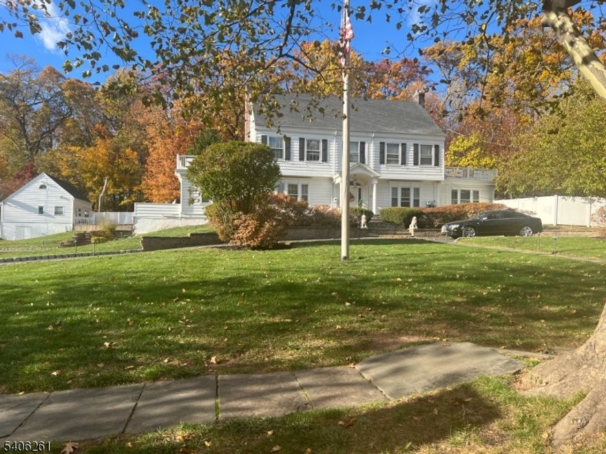 Stunning 6-bedroom, 5-bath Colonial offering 5,412 sq. ft. of refined living on 1.33 beautifully landscaped acres overlooking Woodwild Park Reservation. This elegant home features a grand foyer with sweeping staircase, hardwood floors, crown molding, and three fireplaces. The gourmet, updated kitchen showcases top-of-the-line Thermador appliances, custom cabinetry, and high-end finishes. Enjoy multiple living and entertaining spaces with French doors and classic architectural details throughout. Outdoor highlights include multiple porches and patios, two expansive second-floor decks, and a backyard oasis with an inground saltwater pool. Full basement with half bath and ample storage. A separate renovated 2-bedroom guest house with loft, central A/C, and in-unit washer/dryer adds exceptional flexibility for guests or income potential.