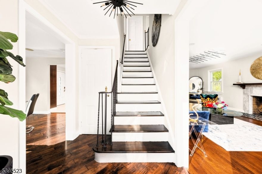 Step inside this beautifully renovated three-bedroom, two-and-a-half-bath Colonial in the heart of Maplewood, New Jersey. A home that blends modern comfort with timeless character. Take in the kitchen's heated floors and sleek, 11-foot center island that flows into the dining area.  A spacious living room with wood burning fireplace and original hardwood floors invite you to a multipurpose sun studio and opens to an expansive modern deck. Wrought iron railings lead you upstairs where you'll find three inviting bedrooms, a full bath with relaxing jacuzzi tub and separate shower, along with convenient access to a walk-up attic for added space. The finished basement is complete with original terrazzo floors, dual entrance, full bath and provides ultimate versatility, whether for guests, a home office, or recreation. Multiple parking spaces precede a two-car garage, greeted by a quaint backyard gazebo. Ideally located just minutes from the South Orange and Maplewood train stations, with quick access to schools and universities, local jitneys,  major highways, parks, airports, and the vibrant downtown.
