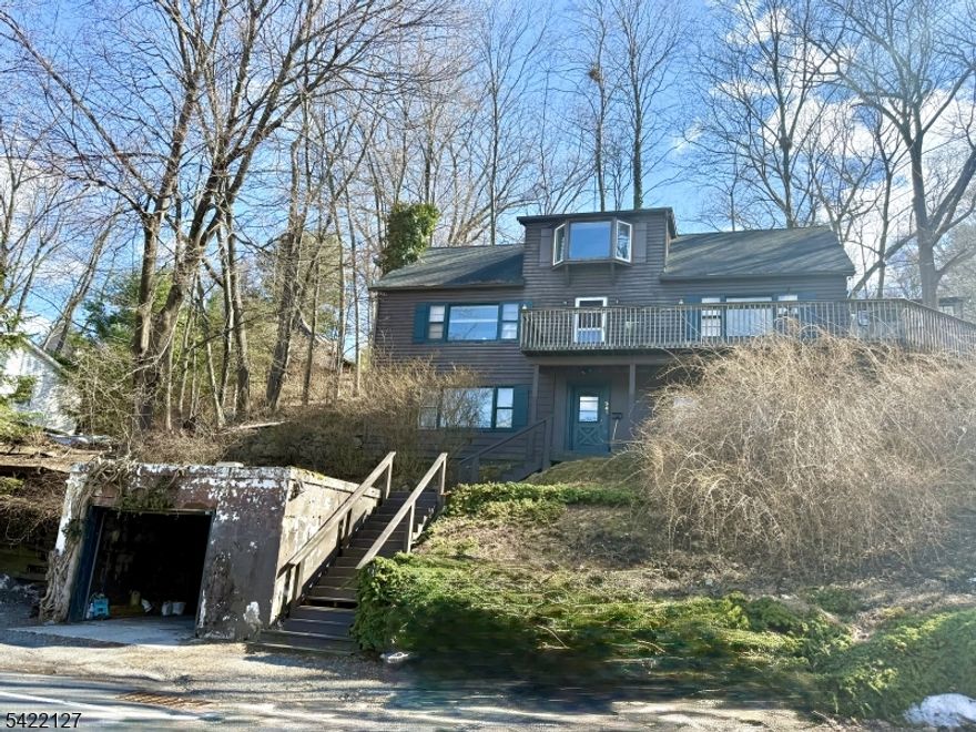 Sparta: Welcome to Lake Mohawk, 4 Bedroom, 2 Bathroom Home with Year Round Lake views. 3 Levels of Living Area, walk into the Ground Floor Foyer with a large Rec room & utility room. Stairs up to the 2nd floor main Living area with main bath, Large Livingroom with wood burning Freestanding wood stove, Diningroom & Kitchen and two Bedrooms, Third Floor has 2 bedrooms and full Bathroom. Wrap around deck connecting between Livingroom and Kitchen with Views Lake Mohawk. Come Live the Lake Life build out your dream home!