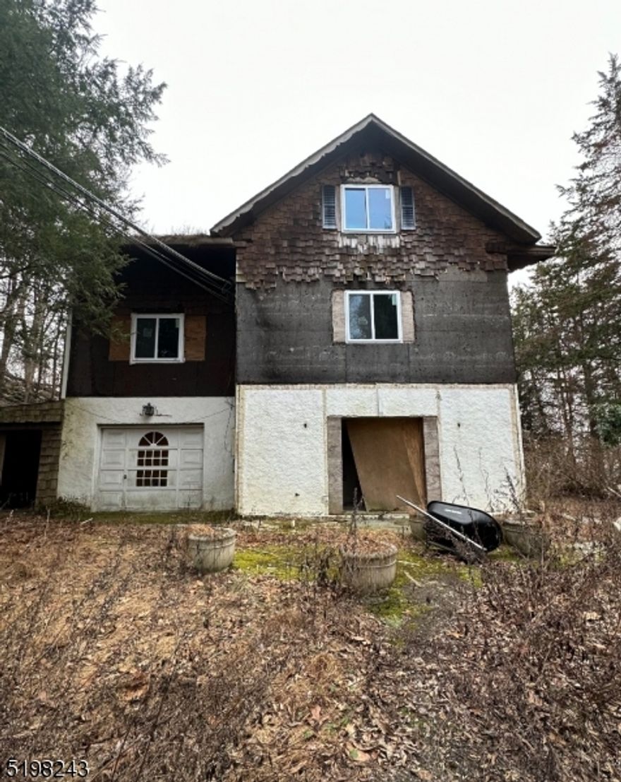 Investment opportunity to make this 4925 square foot home with 3 car oversized garage on over 2.5 acres of land. Some work has been started and is ready to complete.