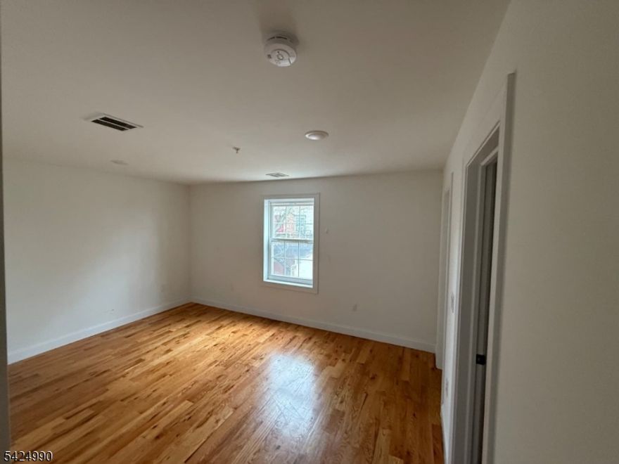 Opportunity to own a multi-family property with strong value-add potential in Newark. The property features 9 bedrooms, 3 bathrooms, and a full basement, with existing plans for a potential 3-family conversion (buyer to verify all approvals and zoning). The ground floor space offers flexibility for possible residential conversion or garage use. The property is being sold as-is and requires renovation. Notable conditions include missing tiles in the first-floor bathroom, and on the third floor, a hole in the exterior trim, a hole in the wall, discoloration under the living room window, a missing bedroom wall, and prior ceiling discoloration in the living room. Buyer is responsible for all inspections, certifications, and approvals.