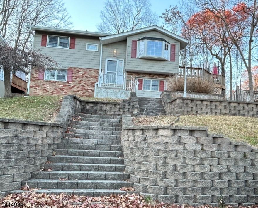 Amazing opportunity near Lake Hopatcong!!! It's got curb appeal! Amazing wrap-around deck for entertaining and outdoor living! Inside needs some sprucing up, but great potential. 2 Bedrooms and a full bath upstairs, 2 bedrooms and a half bath downstairs. Beach membership option. Lots of outdoor activities in the area.