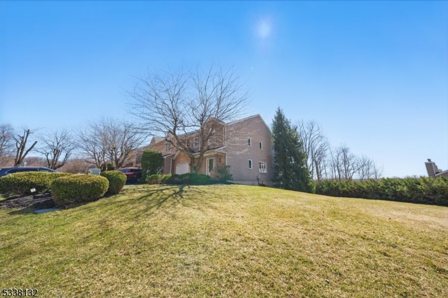 Ideal Floor Plan & End-Unit Location! Bright & Open Living Space amongst 3 levels. North facing Sycamore model with 2 story foyer and skylight. Stone Fireplace. Deck overlooks stunning views. Desirable Private Setting on the end, with bonus grass area. Hardwood Floors. The white kitchen offers lots of cabinetry & counter-space. The formal dining area blends subtly into the well designed living area. Conveniently located half-bath. Wonderful blend of the contemporary with the traditional. Many windows throughout offer an amazing amount of natural light + recessed lighting. The primary suite is spacious, walk-in closet & bath. 2 more nice sized bedrooms on the 2nd floor w/clean full bathroom. Bonus basement space w/ family room & exercise room. Extra storage space on this level along with a laundry room & 2 car garage access. Extremely Skyview Heights offers an association pool, playground & tennis courts a short walk from townhome. Close proximity to Parsippany's excellent public schools, highways, commuter locations (bus/train into NYC) and downtown restaurants and shops. Great value for this particular townhome which boasts the best location and layout.