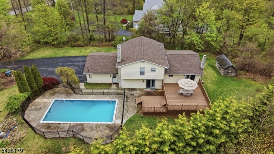 Welcome to this 4-bedroom, 1.5-bath home set on a wooded property in Harmony Township, offering a peaceful and private setting while still providing convenient access to nearby amenities. Surrounded by nature, the property creates a quiet, tucked-away feel that is ideal for those seeking space and tranquility.Inside, the home features a thoughtfully updated kitchen completed in 2023 with Brazilian marble countertops, new cabinetry, and a stylish backsplash. Refinished hardwood floors in the living room and kitchen (2026) add warmth and character, while new first-floor carpeting (2026) enhances comfort.The dining room opens to a large back deck, providing a seamless transition to outdoor living ideal for relaxing or entertaining.Additional updates include a roof (2020), garage doors (2020), refrigerator and dishwasher (2023), and a water heater (2024), offering added value and peace of mind.Step outside to enjoy the in-ground swimming pool, complete with a new pool cover, creating a great space for outdoor enjoyment and relaxation.A well-maintained home combining recent updates, natural surroundings, and a serene setting ready for its next chapter.