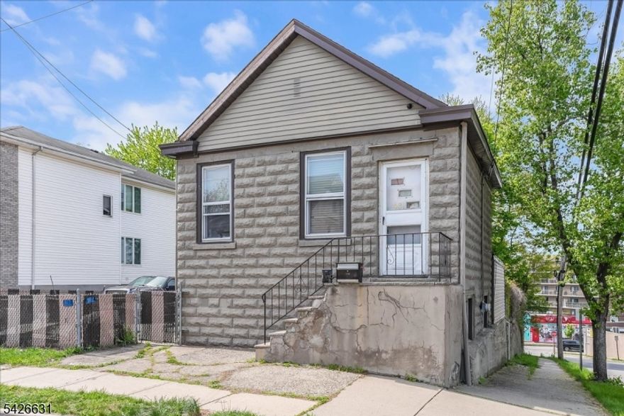 True 2 family home with tons of potential. Great investment property with separate utilities and a large lot. Significant potential for the right buyer. Unit 1 located on the 1st floor has 3BRs, 1 full BA, kitchen, dining area, living room & laundry area. Unit 2 located on the 2nd floor has 1 BR, 1 full bath, kitchen, dining area and a living room. Close to shopping, restaurants, highways and NJ transit. This property is being sold "AS IS".