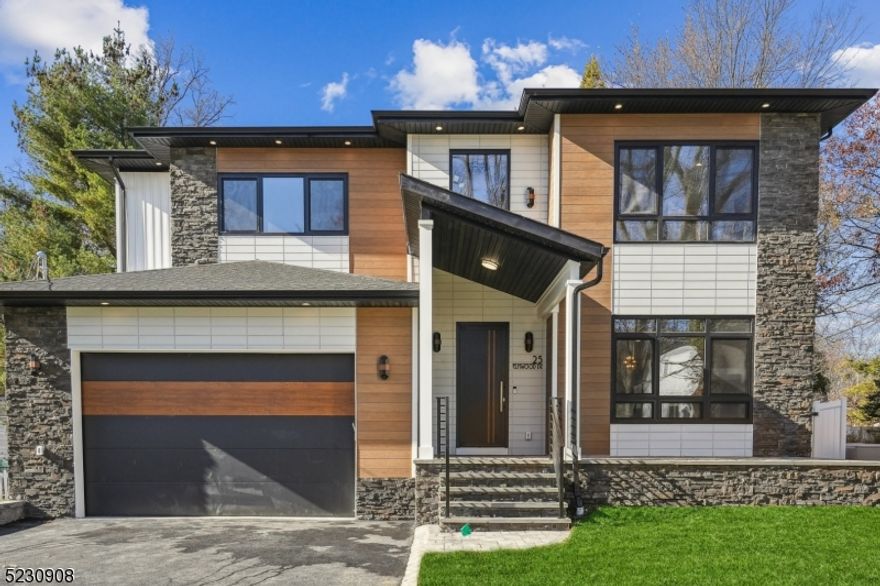 Brand New Construction by NJGCBCORP, a leader in Modern Architecture and Design.   Contemporary Style meets Luxurious Living in this stunning Custom Smart Home with 4,600sq ft of livable space.    An Impressive Home with Floor to Ceiling Windows, Modern Staircases, and Open Concept Living.  First Floor w/10ft Ceilings, Formal Living Rm, Dining Rm, Large Family Room w/Gas FP and Sliders leading to Stone Patio - creating a seamless indoor outdoor flow for entertaining.   A thoughtfully appointed Gourmet Kitchen w/ High End SS Appliances, Walk-in Pantry, Custom Cabinetry & Large Center Island w/Quartz Waterfall - perfect for hosting formal dinners or casual gatherings.   First Floor Guest Suite w/ Bedroom & Full Bath,  Mudroom & Powder Room complete first floor.  A Luxurious Primary Suite w/ Vaulted Ceilings, Custom WIC's and a Tranquil Spa Bath w/soaking tub, Dual Vanity and Heated Floors. Three additional large bedrooms, two full baths and Laundry Room complete 2nd Floor.   A Finished Walk-out Basement designed for Comfort, Fun and Relaxation with a 6th Bedroom,  Full Bath, Media Room w/ soundproofing & speakers, Rec Room & Home Office/Gym.  Landscaping package includes Sod, Irrigation System, Paver Patio, Trees and Fence.   A  Modern Masterpiece of Contemporary Design.