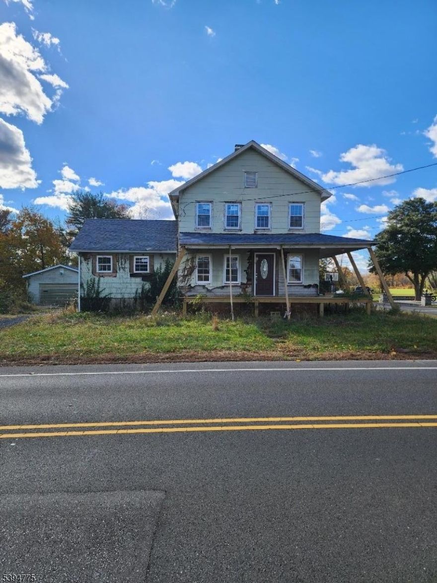Introducing homeownership and investment opportunities at 899 Adelphia-Farmingdale Road a 3-bedroom, 2-bathroom single-family home set on over 1 acre in one of Monmouth County's most desirable locations. This property blends classic charm with the space and potential to become something truly special. Gutted and ready for finishing, featuring a new roof and windows and a wrap-around porch, the home invites creativity, personalization, and long-term vision. While the property does need work, it offers a solid structure, a spacious interior layout, and a picturesque lot, making it ideal for thoughtful renovations and lifestyle customization. Enjoy the privacy and flexibility of 1+ acres perfect for gardening, entertaining, or designing the backyard retreat of your dreams. Whether you're a homeowner ready to build equity or an investor looking for your next opportunity, this property delivers. Don't miss your chance to own in Freehold Township at a great value. Schedule your showing today and explore the potential of this amazing property.