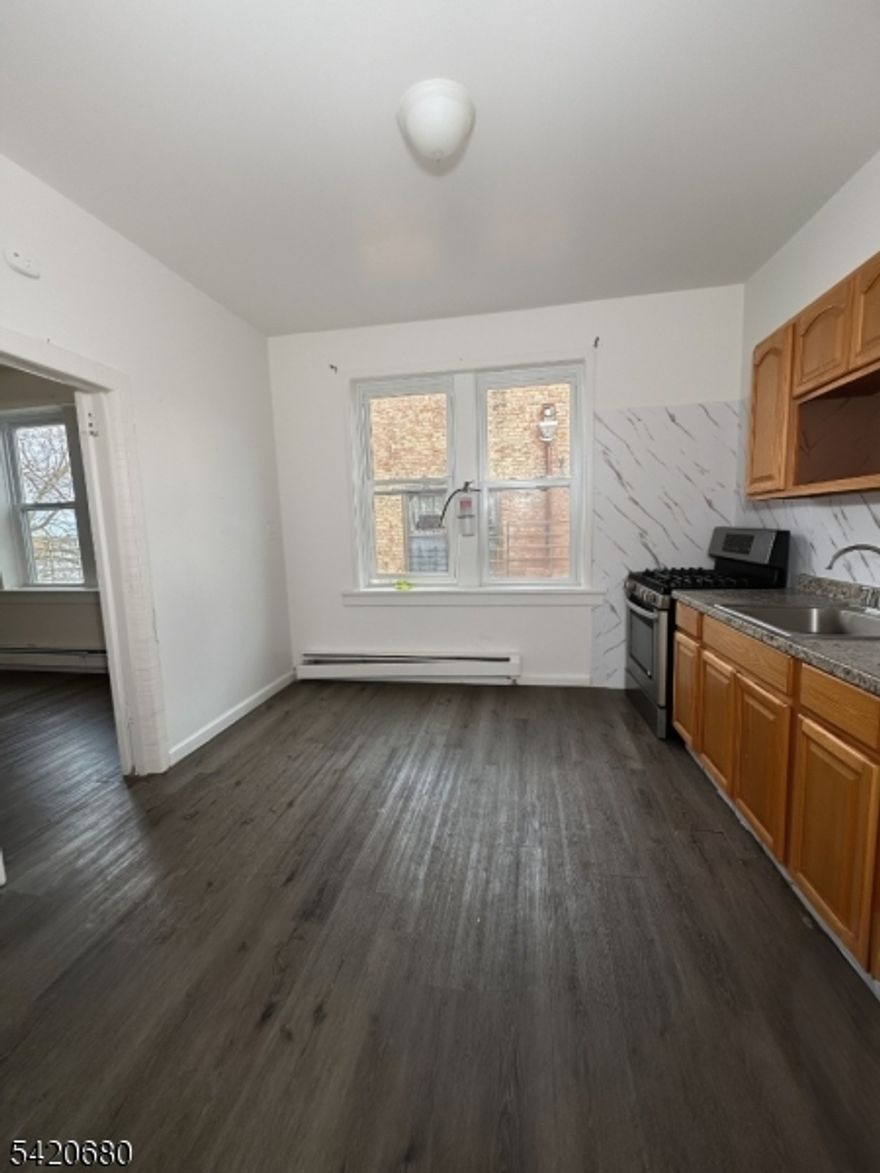 1-bedroom apartment offering a functional and comfortable layout. Located on the third floor of a walk-up building, this unit features a spacious eat-in kitchen, along with a walk-in pantry. The apartment also includes a bright living room and a well-sized bedroom, creating a cozy and practical living space. A great opportunity for convenient living!