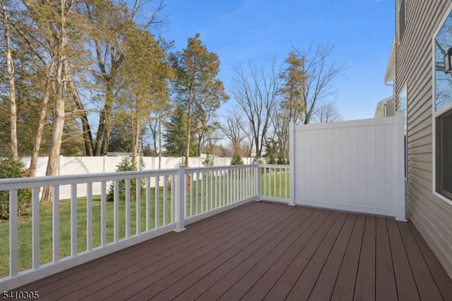 Experience elevated living in this brand-new, never-occupied corner side unit, newly built in 2024, offering 3 bedrooms and 2.5 baths with refined finishes and a thoughtfully designed open-concept layout filled with natural light. The main level is ideal for both everyday living and entertainment, featuring a chef-inspired kitchen with sleek quartz countertops, custom cabinetry, premium appliances, and an oversized island that flows seamlessly into the living and dining areas. Wide-plank luxury vinyl flooring extends throughout and opens to a private Trex deck perfect for outdoor dining or relaxation. The upper level offers a serene owner's suite with vaulted ceilings, a custom walk-in closet, and a spa-like bath with dual vanities and warm water bidet installed. Two additional generously sized bedrooms, a stylish full bath, and convenient second-floor laundry complete the home. Ideally located near upscale shopping, dining, major highways, and effortless NYC transportation, this pristine corner unit presents a rare opportunity to own a move-in-ready new construction offering modern luxury, added privacy, and exceptional convenience.