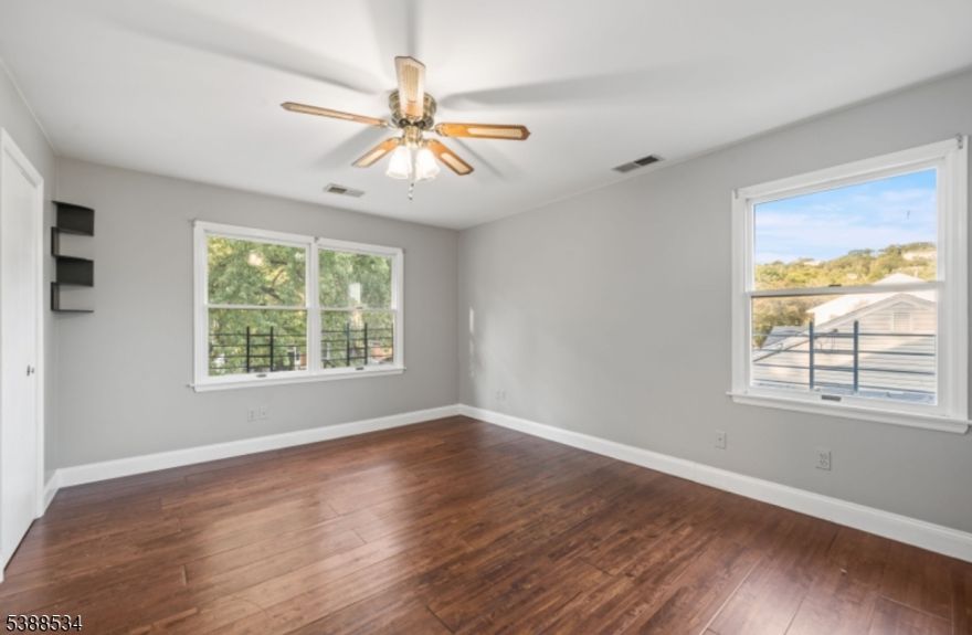 Welcome to 136 Haroldson Place, a spacious five-bedroom, three-bath home located in the heart of Pompton Lakes. This property offers an ideal blend of comfort, convenience, and style. The updated kitchen features modern finishes and ample storage, opening into generous living areas perfect for everyday living or entertaining. A light-filled four-season room extends your living space year-round, creating the perfect spot to relax with morning coffee or unwind in the evenings. Step outside to a beautiful deck that overlooks the backyard ideal for summer gatherings and quiet evenings outdoors. With five bedrooms, this home easily accommodates larger households, guests, or flexible options such as a home office or workout space. The three full baths are thoughtfully designed for both function and comfort. Situated right in the center of town, you'll enjoy easy access to shopping, dining, schools, and the NYC bus stop just moments away perfect for commuters.  Please note, this property is located in a designated flood zone and may require flood insurance depending on your lender. Don't miss the opportunity to make this centrally located and beautifully updated home your own.