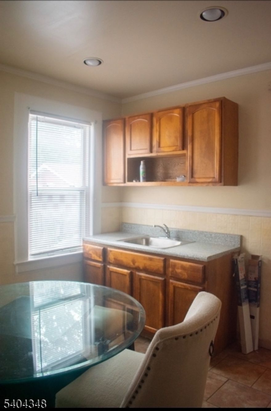 Quiet, Spacious 2/3 Bedroom Near Seton Hall " Ivy Hill' section. Looking for space, peace, and convenience? This bright first-floor 2-bedroom, possible 3 bedroom (perfect for a home office or extra room) is tucked away on a quiet, tree-lined street in Newark's desirable Ivy Hill neighborhood, just minutes from Seton Hall University and South Orange. The home features a comfortable living and dining area, a large eat-in kitchen, and access to a shared backyard   ideal for getting fresh air without leaving home. Enjoy easy access to public transportation, shopping, dining, and major routes while still living in a calm residential setting. Highlights:*First-floor unit*2 bedrooms *Large eat-in kitchen* separate dining room*Backyard access*Quiet, residential block near Seton Hall & South Orange. Terms: No pets. No smoking. No laundry onsite. Available now.