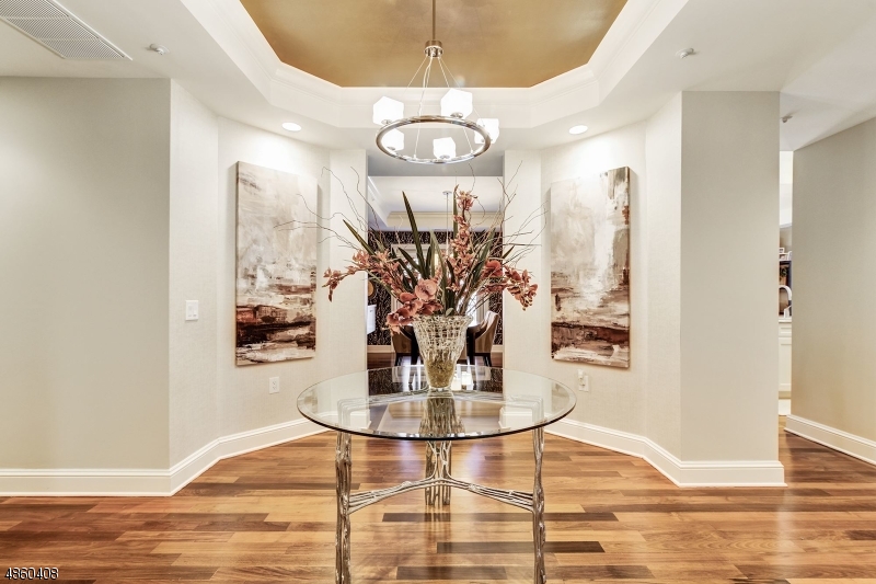 Magnificent Builder's Model. 2492 sq ft of Fabulous Living Space. 2 BR with 2.1 Baths & Large Den. Located in the Center of Morristown overlooking the Green. Luxury living with full Concierge Service. Spacious, elegant unit exemplifies what in-town Morristown living is all about! Enjoy maintenance free condo living that includes hardwood floors, 9' ceilings, marble bathrooms, gourmet kitchen with stainless appliances and granite.Also has plenty of closet space including 2 Walk-in closets in Master BR. Includes 24/7 workout gym, private club room with billiards, TV, full wall Fireplace and Catering Kitchen. Comes with 2 assigned parking spaces in temperature controlled private parking garage. Walking distance to Restaurants, Bars, Mayo Performing Arts Center, Starbucks, Dunkin, Whole Foods, Kings and more.