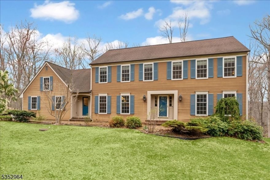 Tucked away on two serene acres at the end of a quiet cul-de-sac, this charming 4-bedroom, 2.1-bath Colonial feels like a total retreat from the everyday. Lovingly maintained and thoughtfully updated, it seamlessly blends classic elegance with the essential comforts of modern living.Step into a sunlit foyer leading to gracious formal living and dining rooms, where gleaming hardwood floors and custom crown molding add timeless character. The heart of the home is the beautifully updated kitchen, designed for gathering. It features high-end stainless steel appliances, custom cabinetry, and a generous breakfast bar for casual meals. Sliding doors open to a spacious deck, perfect for hosting summer BBQs or enjoying a quiet morning coffee while overlooking your private woodland.Upstairs, the primary suite serves as a peaceful haven with a private bath and ample closet space. Three additional bedrooms offer flexibility for guests, or a bright home office. A warm and inviting den, first-floor laundry, and abundant storage complete the well-designed layout. The walk-out finished basement adds another layer of versatility, providing the ideal setup for a media room, gym, or play area.This home is as functional as it is beautiful, featuring an impressive list of recent mechanical updates for worry-free living, including a brand-new furnace, heat pump, and A/C (2024), a new hot water heater and well tank (2023), and a generator. Close to town and schools.