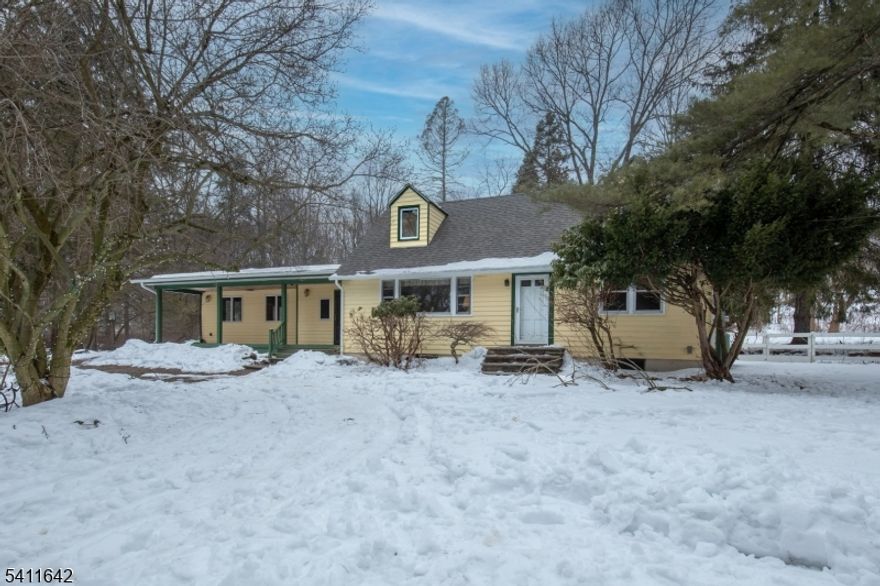 Welcome to beautiful Tewksbury. 10 min to I78, commuter rail, restaurants, shopping and the state's finest schools. Perfectly situated on a private road this home is ideal for buyers with vision, who are ready to transform a house into their dream home. Step onto the large covered front porch or the back patio and enjoy the 1.7 private and tranquil acres. Inside you'll find the spacious family room featuring vaulted ceilings and skylights; this rustic warm family room has both a fireplace and wood stove and would be a wonderful place to entertain or just cozy up on a cold winter's day. This room is open to the dining and kitchen areas. This home will require work, but the rewards could be incredible for the right buyer. With solid bones and standout features throughout, it's a rare opportunity to customize and build equity. Moments from hiking, horse and biking trails such as the Columbia Trail, and reservoirs for camping, boating and fishing. such as Spruce Run and Round Valley