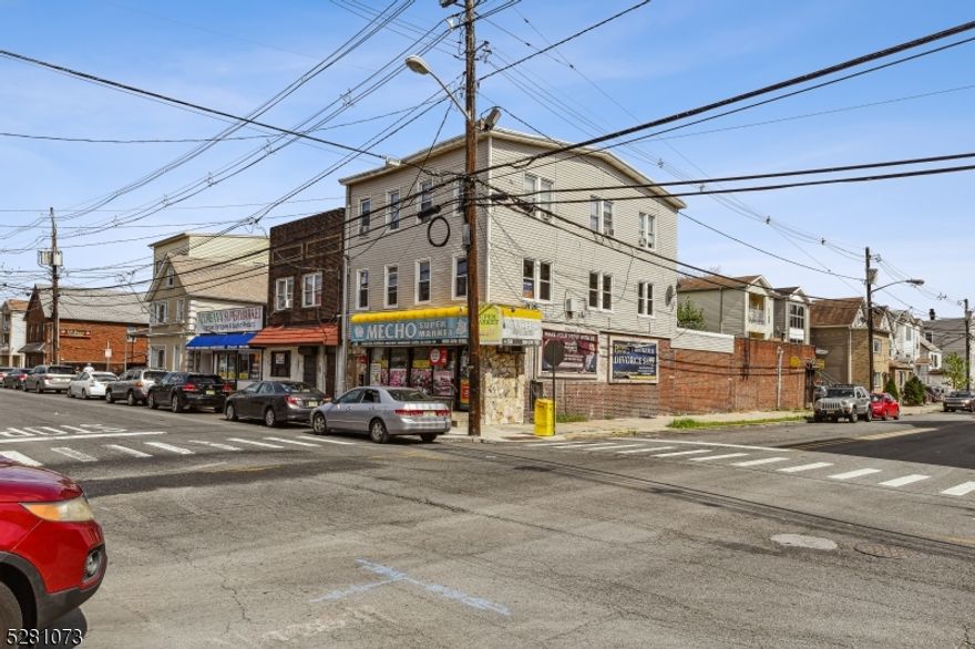 Exceptional mixed-use investment in a prime opportunity zone, steps from the new Elizabeth Ferry, with easy access to NYC. Nestled in the heart of Elizabeth's bustling downtown area, this corner property is encircled by shops and dining. Ground floor boasts a community staple: a convenience/grocery store. Above, 2 fully renovated 3 and 4-bedroom apartments offer modern living. Unmissable care-free income potential in this prime location!