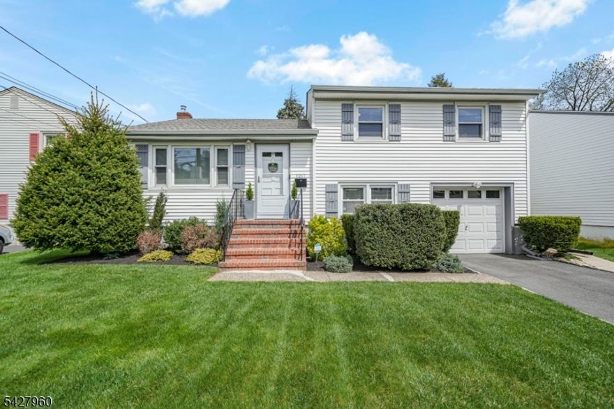 Move right into this meticulously maintained split-level home with pristine landscaping and standout curb appeal in one of Union's most convenient locations! Step into a bright, welcoming living room with a dedicated coat closet, thats flows seamlessly into the dining area. The kitchen has been thoughtfully refreshed with new backsplash and flooring, complemented by original real red oak cabinetry that adds warmth and timeless character! Hardwood flooring extends throughout the main living area and all bedrooms, while a fresh, neutral paint palette enhances the home's clean, move-in ready feel. Upstairs offers three well-sized bedrooms, each with its own closet, along with an updated bathroom complete with a tub. Downstairs, there is a cozy den, a half bath, and direct access to the backyard and garage. A semi-finished basement further expands the home's functionality with a recreation area, dedicated laundry space, and ample storage. Outdoor perks add even more value with a newer concrete patio, upgraded drainage system, gutter guards, and Ring smart exterior lighting, creating a backyard that is both polished and low-maintenance. The garage stands out with Racedeck flooring and a smart video keypad entry system, blending convenience with a polished finish. Ideally located near Union's local restaurants, shops, and bus lines, with easy access to major highways and NYC transportation! This is a true move-in ready home no heavy lifting here except your moving boxes!