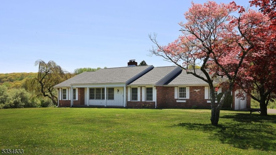 TERRIFIC OPPORTUNITY ON PRIME, SPRAWLING 2+ ACRE LOT!  CALLING ALL CONTRACTORS, REHABBERS, BUSINESSES AND BUYERS WITH  VISION!  Possibilities abound in this 2-3 bedroom, 2.1 bath Ranch home on a beautiful, private lot with incredible scenic views.  Located well back (but visible) from the roadway in a mixed residential/business district, it is perfect for a professional home business or office, a contractor, or someone who wants to design and renovate their dream home!  The house is incredibly spacious, with all large rooms, a walk-out lower level that could be converted to an office, en suite bedroom or in-law suite, and plenty of closet and storage space.  The Dining Room could also be a bedroom!  The home also features a newer roof, all newer windows and upgraded electric.  It has great bones, although it needs extensive interior renovation. There is plenty of parking with a long drive that fans out between the oversized 2-car garage and storage shed. The location is perfect, nestled among a semi-rural stretch of the road harboring both single family homes, businesses and restaurants, with plenty of space and privacy in-between them all. The right person with the right vision could make this perfect fixer-upper an incredible home or business!  Let it be you!