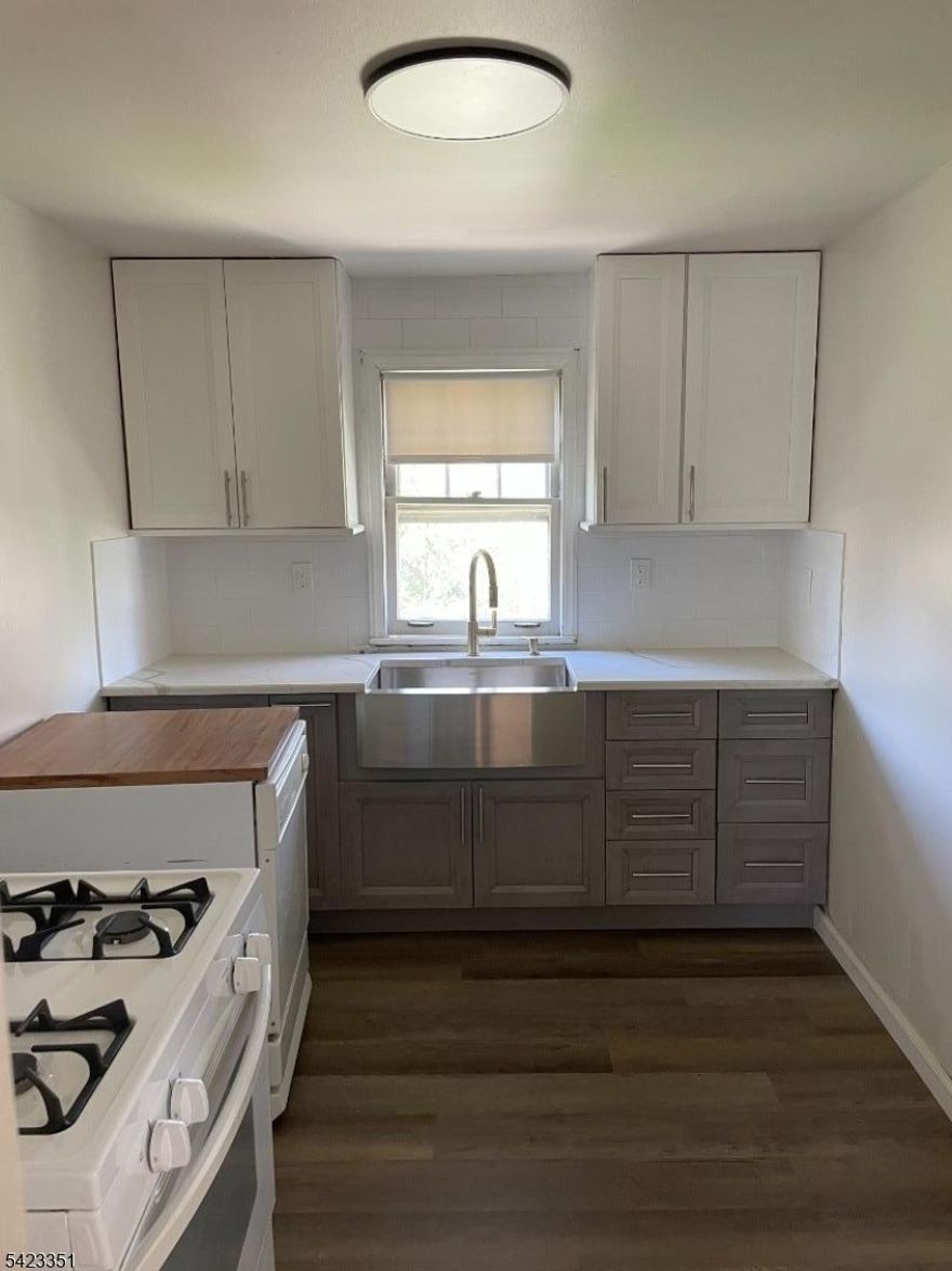 Bright freshly painted 2 bedroom unit.  Brand new kitchen and tiled bathroom. Located on quiet tree lined street walking distance to downtown shops, restaurants, parks, and public transportation. Easy access to NYC by bus or train. Close to major highways Rt 287, Rt 80, and Rt 46.