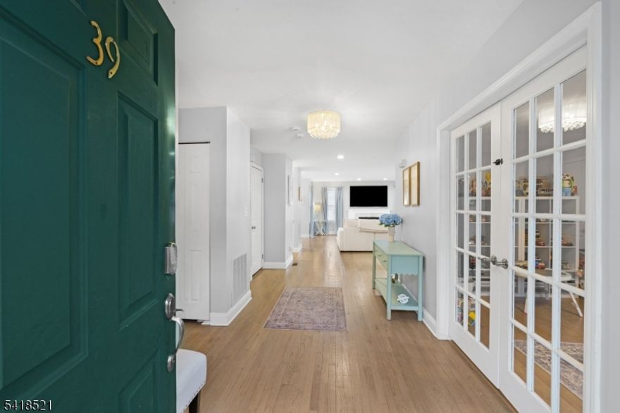 Welcome to this beautifully renovated townhome in the highly desirable Timber Valley community of Wayne. Offering over 2,400 sq ft of living space, this bright and spacious home features 3 bedrooms, 2.5 bathrooms, and a dedicated office/den, providing flexibility for modern living. Step inside to an inviting open-concept layout with rich hardwood floors and abundant natural light. The main level includes a stylish home office with French doors, a renovated powder room, and an expansive living and dining area centered around a cozy wood-burning fireplace perfect for both relaxing and entertaining. The chef's kitchen is a standout, showcasing high-end appliances, quartz countertops, a dramatic waterfall island, and ample cabinetry for storage. A sunny breakfast area with skylight opens directly to a private deck, creating an ideal indoor"outdoor flow. Upstairs, the primary suite features an oversized walk-in closet and a beautifully updated spa-like bath with soaking tub and separate shower. Two additional bedrooms, a full bath, and convenient second-floor laundry complete the upper level. Additional highlights include a one-car attached garage, central air, and extra storage. Located in a sought-after community close to shopping, dining, parks, and major commuting routes, this move-in-ready home combines style, comfort, and convenience.