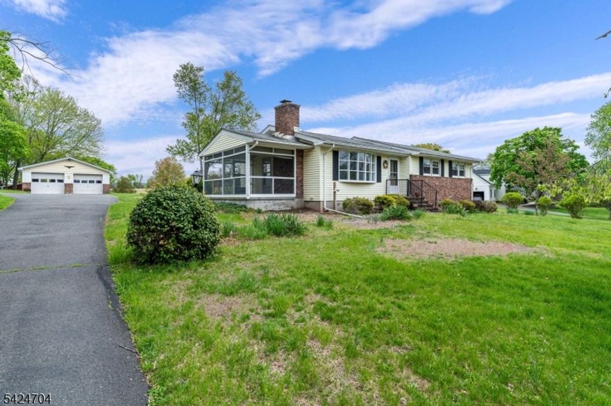 Discover the appeal of single-level living in this charming 3-bedroom ranch set on a beautiful 1.59-acre open lot backing to preserved farmland, your own private slice of Hunterdon County. Inside, refinished hardwood floors, fresh paint, and a tastefully updated full bath create a warm, move-in-ready atmosphere. The three-season room provides additional living space and offers potential for conversion to year-round use. The property features an oversized detached 2-car garage, ideal for hobbyists or equipment storage, along with an additional shed and a livestock shelter. Public water is in place, and natural gas is available at the street. Enjoy a peaceful rural setting just minutes from Rt 31, I-78, parks, top-rated schools, and the shops and restaurants of Clinton and Flemington, a serene location with exceptional convenience.